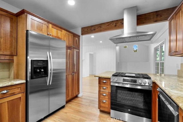 11 Dapplegray Ln, Rolling Hills Estates, CA 90274 - kitchen featuring stainless steel appliances, wall chimney range hood, brown cabinets, and light wood-style floors