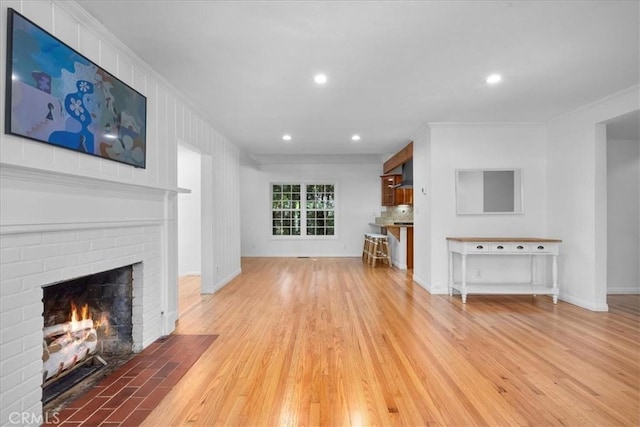 11 Dapplegray Ln, Rolling Hills Estates, CA 90274 - living room featuring ornamental molding, a fireplace, light wood-type flooring, and recessed lighting