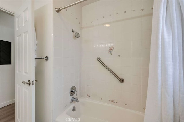 5856 E Scrivener St, Long Beach, CA 90808 - bathroom with shower / bath combination with curtain and wood finished floors