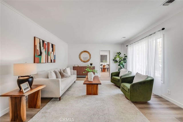 5856 E Scrivener St, Long Beach, CA 90808 - living room featuring ornamental molding and light wood-type flooring