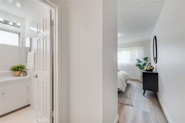 5856 E Scrivener St, Long Beach, CA 90808 - hallway with light wood-style floors