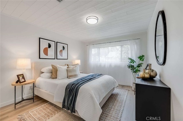 5856 E Scrivener St, Long Beach, CA 90808 - bedroom with light wood finished floors and wood ceiling