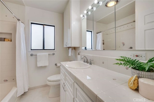 5856 E Scrivener St, Long Beach, CA 90808 - full bath featuring double vanity, tile patterned floors, and shower / tub combo with curtain