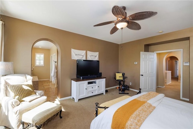 1759 Crebs Way, Upland, CA 91784 - bedroom with arched walkways, light carpet, and ceiling fan