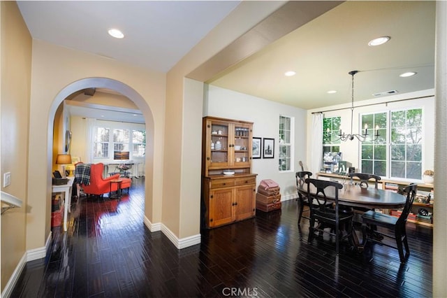 1759 Crebs Way, Upland, CA 91784 - dining room featuring dark wood-type flooring, arched walkways, recessed lighting, and a chandelier