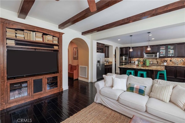 1759 Crebs Way, Upland, CA 91784 - living area featuring arched walkways, beam ceiling, dark wood-type flooring, recessed lighting, and a ceiling fan