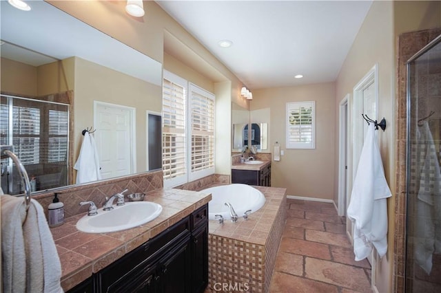 1759 Crebs Way, Upland, CA 91784 - bathroom featuring two vanities, a shower stall, a garden tub, stone tile flooring, and recessed lighting