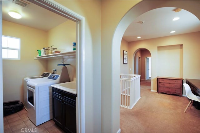 1759 Crebs Way, Upland, CA 91784 - laundry room with arched walkways, washing machine and clothes dryer, recessed lighting, and light carpet