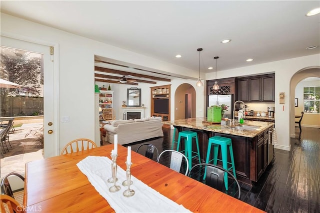 1759 Crebs Way, Upland, CA 91784 - kitchen featuring arched walkways, dark wood-style floors, dark brown cabinets, recessed lighting, and a ceiling fan