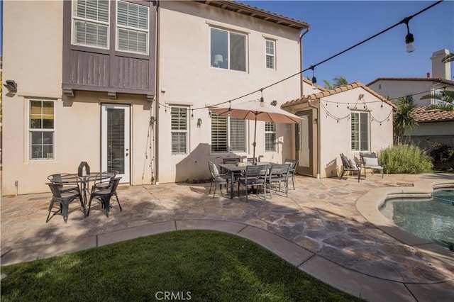 1759 Crebs Way, Upland, CA 91784 - back of house featuring an outdoor pool, stucco siding, a patio area, and a tile roof