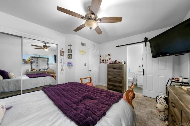 7215 San Pasqual St, Lemon Grove, CA 91945 - carpeted bedroom featuring a barn door, a ceiling fan, a closet, and ensuite bathroom