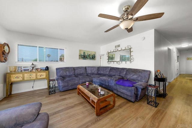7215 San Pasqual St, Lemon Grove, CA 91945 - living room with a ceiling fan and wood finished floors