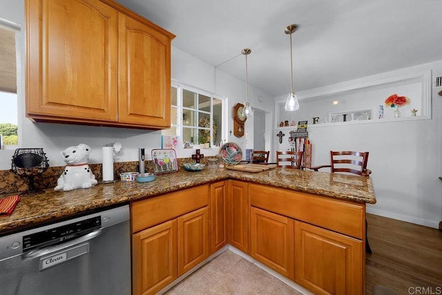 7215 San Pasqual St, Lemon Grove, CA 91945 - kitchen with dishwasher, dark stone countertops, a peninsula, brown cabinets, and hanging light fixtures