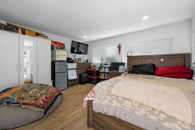 7215 San Pasqual St, Lemon Grove, CA 91945 - bedroom with light wood finished floors, freestanding refrigerator, and recessed lighting