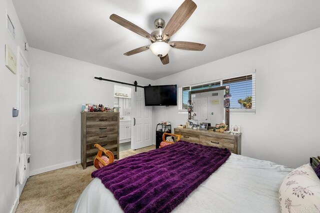 7215 San Pasqual St, Lemon Grove, CA 91945 - bedroom with carpet flooring, a barn door, and a ceiling fan