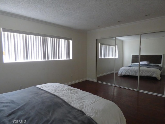 630 W Santa Cruz St, San Pedro, CA 90731 - bedroom with crown molding, a textured ceiling, wood finished floors, and a closet