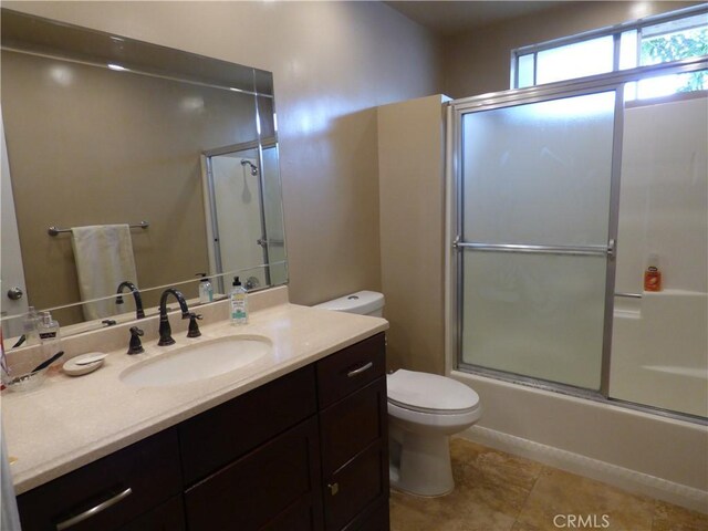 630 W Santa Cruz St, San Pedro, CA 90731 - bathroom with vanity, bath / shower combo with glass door, and tile patterned flooring