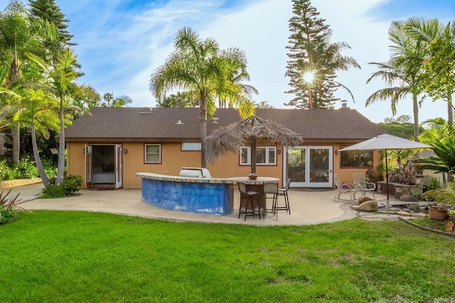 157 Beechtree Dr, Encinitas, CA 92024 - rear view of house featuring a patio, a lawn, stucco siding, and a shingled roof