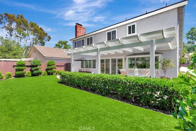 28021 Paseo Reposo, San Juan Capistrano, CA 92675 - back of property featuring a chimney, a pergola, a lawn, and stucco siding