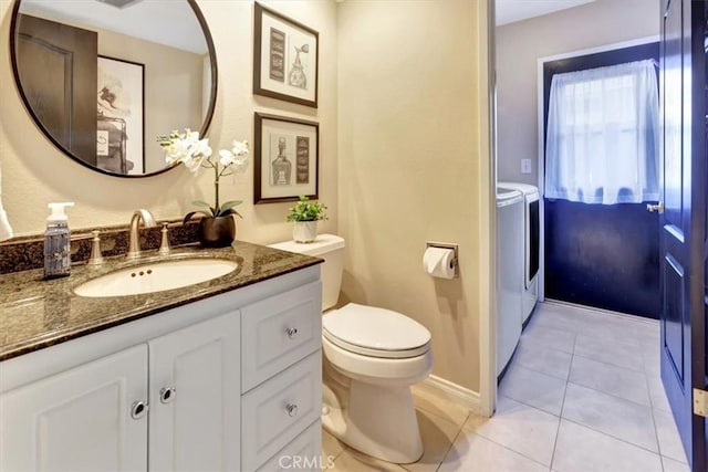28021 Paseo Reposo, San Juan Capistrano, CA 92675 - bathroom with washer and dryer, vanity, and tile patterned flooring