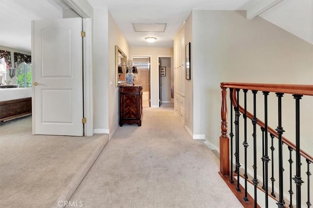 28021 Paseo Reposo, San Juan Capistrano, CA 92675 - corridor with carpet floors, beam ceiling, and attic access