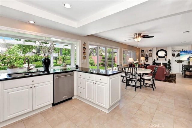 28021 Paseo Reposo, San Juan Capistrano, CA 92675 - kitchen with dishwasher, dark countertops, white cabinets, ceiling fan, and light tile patterned flooring