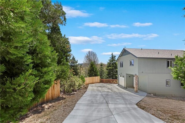 26182 Sky Ridge Dr, Twin Peaks, CA 92391 - view of property exterior with driveway and a garage