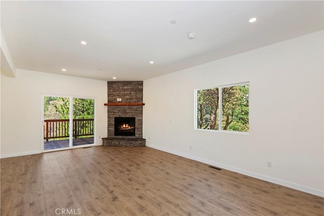 26182 Sky Ridge Dr, Twin Peaks, CA 92391 - unfurnished living room with wood finished floors, a fireplace, and recessed lighting
