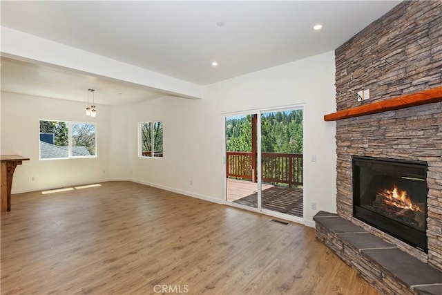 26182 Sky Ridge Dr, Twin Peaks, CA 92391 - unfurnished living room featuring light wood-type flooring, a fireplace, a chandelier, and recessed lighting