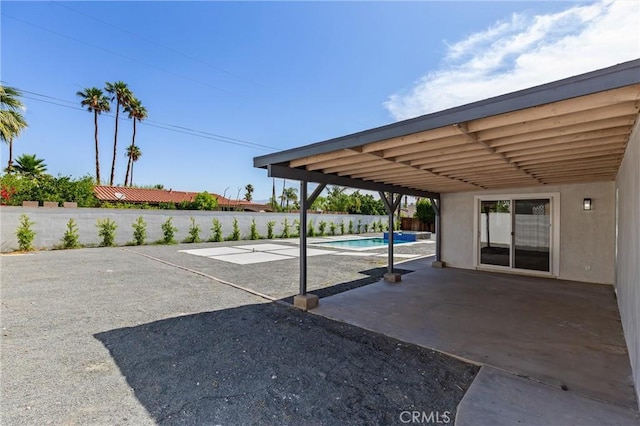 2852 E San Angelo Rd, Palm Springs, CA 92262 - fenced backyard with a patio area