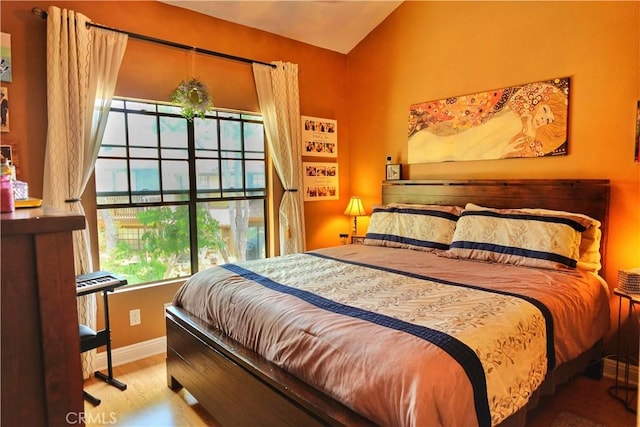 4140 Workman Mill Rd Unit 234, Whittier, CA 90601 - bedroom with lofted ceiling and wood finished floors