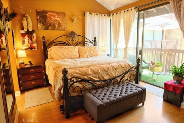 4140 Workman Mill Rd Unit 234, Whittier, CA 90601 - bedroom with wood finished floors, access to exterior, and lofted ceiling
