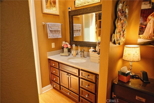 4140 Workman Mill Rd Unit 234, Whittier, CA 90601 - bathroom featuring vanity and wood finished floors