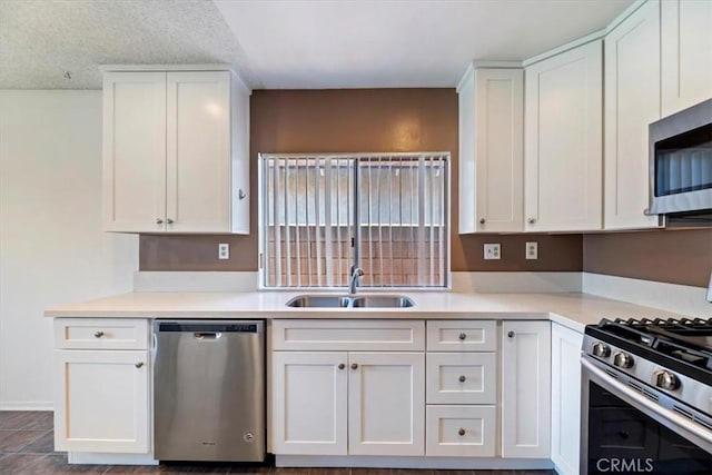 12976 Rhodes Pl, Chino, CA 91710 - kitchen with stainless steel appliances, white cabinetry, and light countertops
