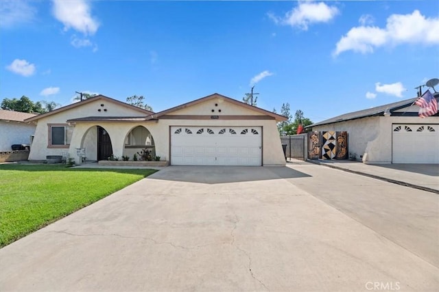 12976 Rhodes Pl, Chino, CA 91710 - view of front of house featuring stucco siding, driveway, and a garage