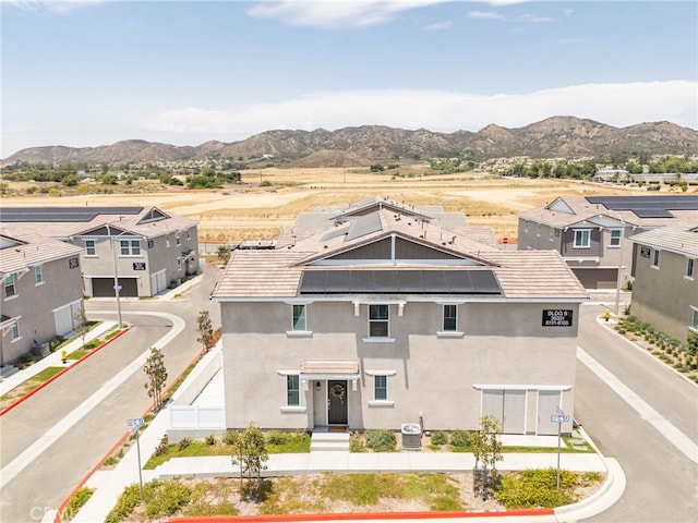 36351 Elizabeth Ln Unit 8105, Wildomar, CA 92595 - view of front of property with a mountain view, roof mounted solar panels, and stucco siding