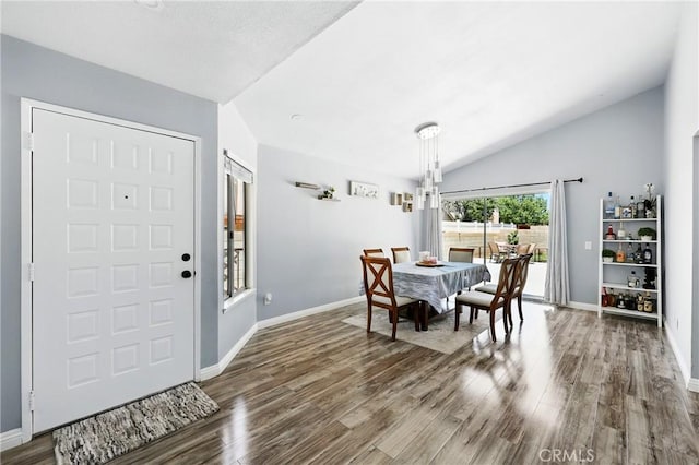 2027 Cape Cod Ln, Palmdale, CA 93550 - dining area featuring lofted ceiling and wood finished floors