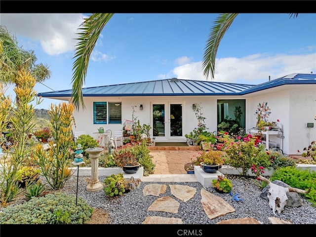 31460 Aquaduct Rd, Bonsall, CA 92003 - rear view of property featuring stucco siding, a standing seam roof, and a metal roof