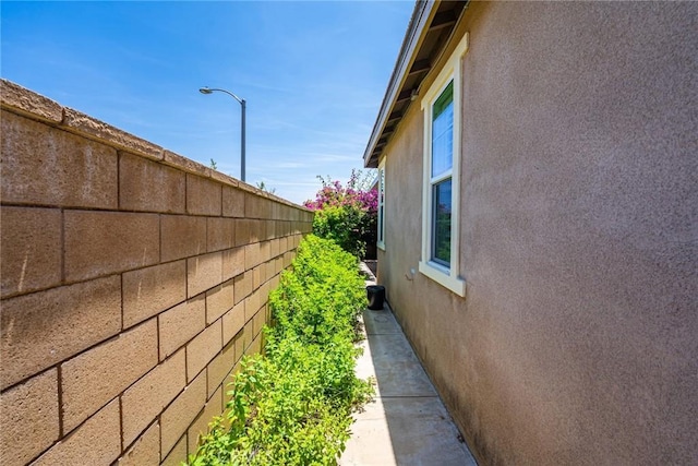 13211 Baxter Springs Dr, Rancho Cucamonga, CA 91739 - view of side of home with stucco siding