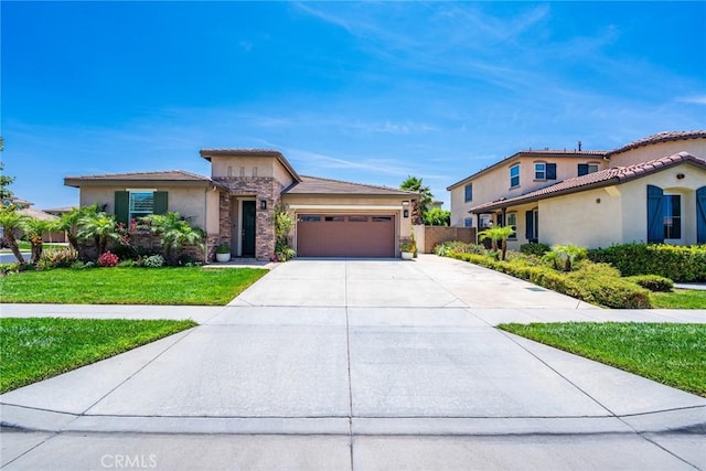 13211 Baxter Springs Dr, Rancho Cucamonga, CA 91739 - view of front of house featuring stucco siding, an attached garage, driveway, a front lawn, and stone siding