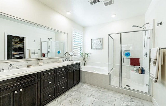 13211 Baxter Springs Dr, Rancho Cucamonga, CA 91739 - full bath with a shower stall, double vanity, a garden tub, marble look tiles, and recessed lighting