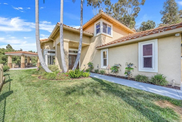 3676 Valley Rd, Bonita, CA 91902 - view of front of house with a front lawn, stucco siding, and a tiled roof