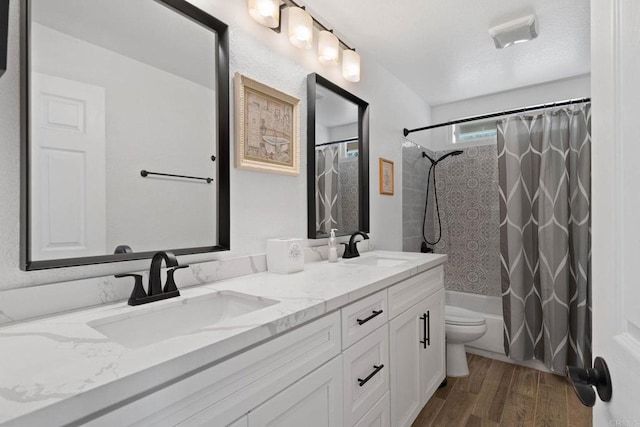 3676 Valley Rd, Bonita, CA 91902 - full bathroom featuring double vanity, wood finished floors, and shower / tub combo