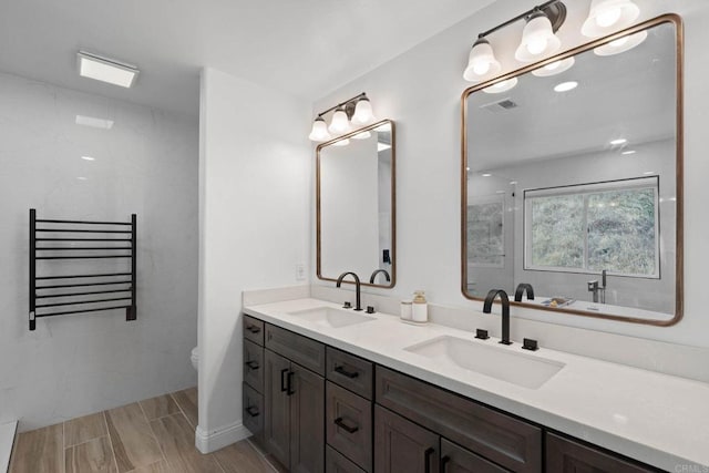 3676 Valley Rd, Bonita, CA 91902 - full bathroom with radiator heating unit, double vanity, a shower, and a towel warming rack