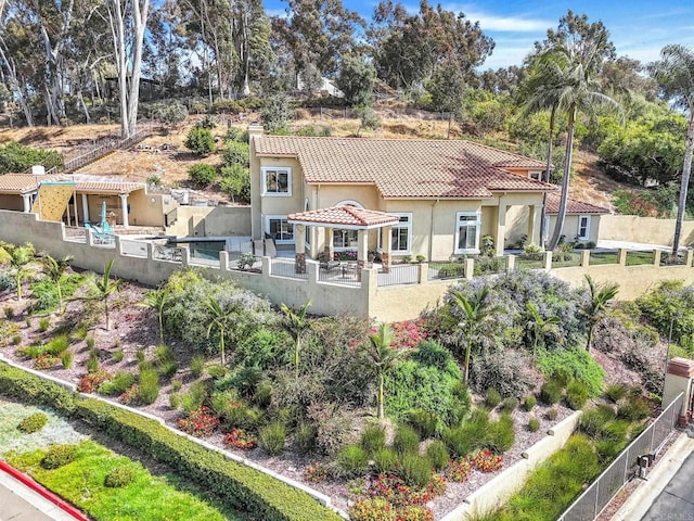 3676 Valley Rd, Bonita, CA 91902 - back of house featuring stucco siding, a fenced backyard, a tiled roof, a chimney, and a patio area