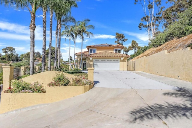 3676 Valley Rd, Bonita, CA 91902 - view of front facade with stucco siding, a gate, a tiled roof, driveway, and roof mounted solar panels