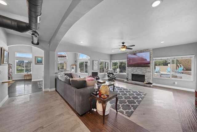 3676 Valley Rd, Bonita, CA 91902 - living room with plenty of natural light, recessed lighting, a ceiling fan, arched walkways, and wood finished floors