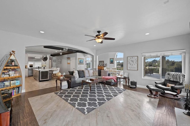 3676 Valley Rd, Bonita, CA 91902 - living room featuring arched walkways, a ceiling fan, beverage cooler, light wood-type flooring, and recessed lighting