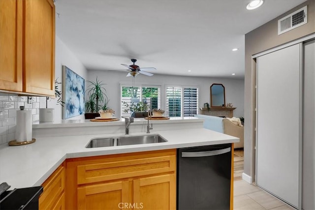 11 Exeter, Irvine, CA 92612 - kitchen with dishwasher, open floor plan, a peninsula, ceiling fan, and backsplash