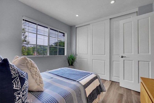 11 Exeter, Irvine, CA 92612 - bedroom featuring wood finished floors, recessed lighting, and a closet